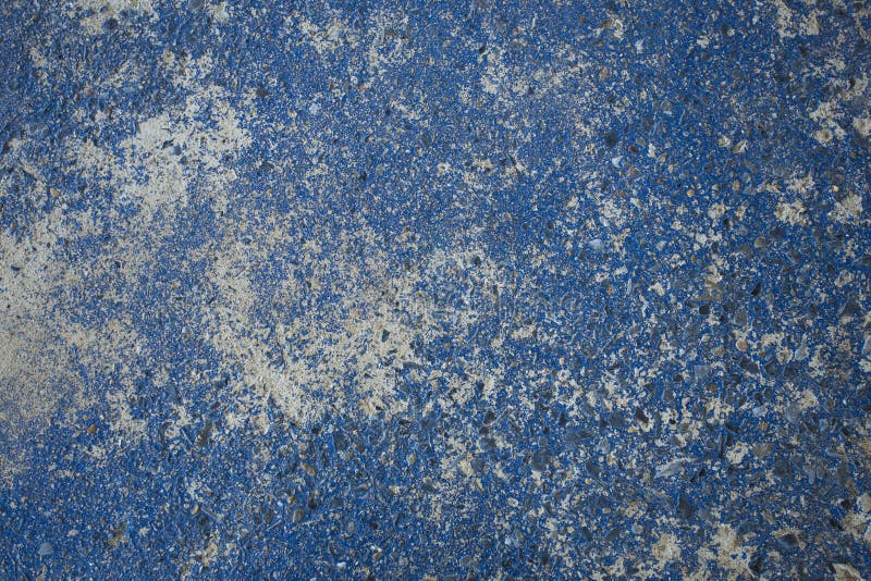 Blue painted on the concrete slab created pattern and texture. royalty free stock images