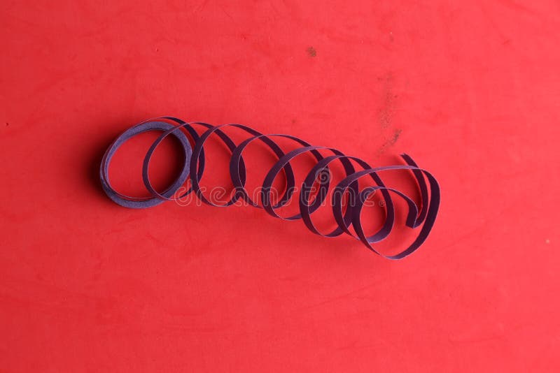 Blue Party Streamers Isolated on a Red Background Stock Photo Image