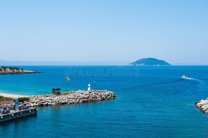Blue pier, Water on the sea from the hill, the boat sails on the sea royalty free stock photo Blue pier, Water on the sea from the hill, the boat sails on the sea royalty free stock photo