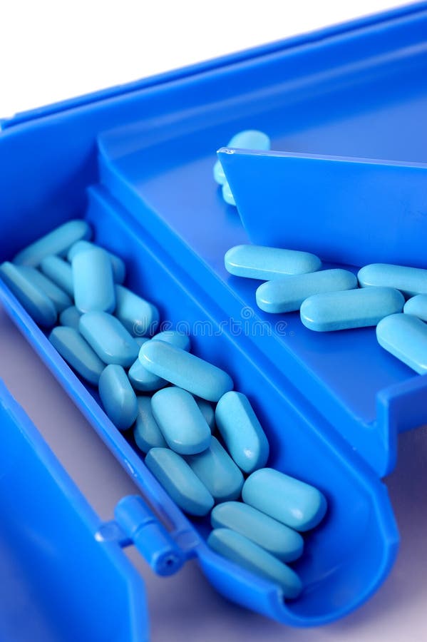 A blue pill counter with tablets