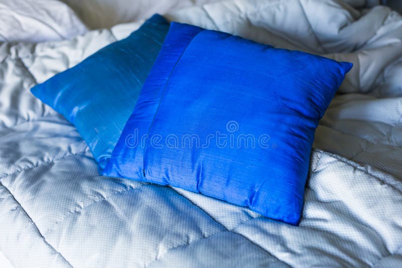 Blue pillows on the bed stock photo. Image of carpet 90783884