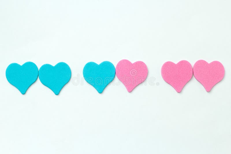 Blue and pink hearts on a white background symbol of same sex and heterosexual relationships