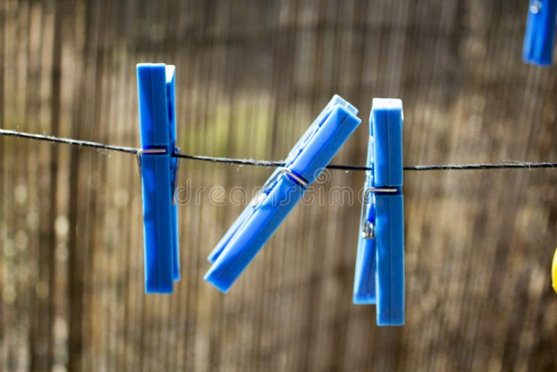 Blue Plastic Clothespins on the Rope Stock Image Image of clothesline