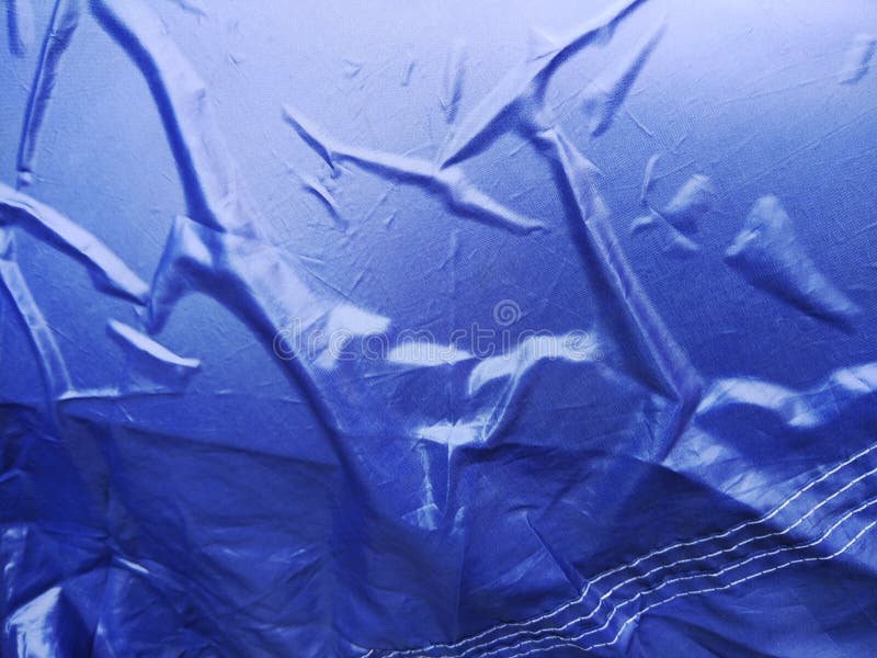 The Blue Plastic Sheet on the Car for Dust and Rain Protection. Stock