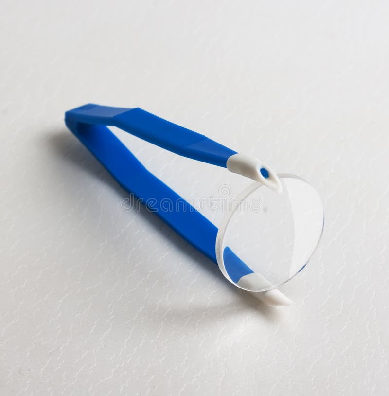 Blue plastic tweezers stock photo. Image of shadow, glass 12373596