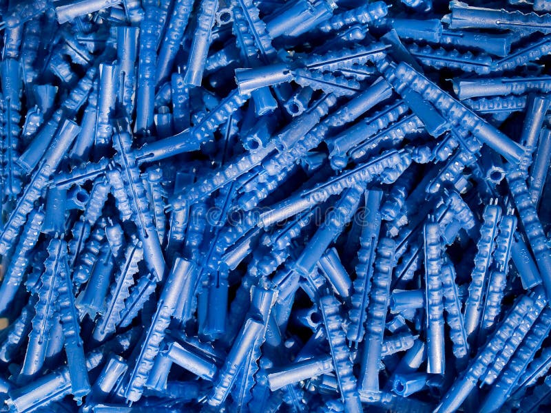 Blue plastic wall plugs stock photo. Image of parts, renovation 18528020
