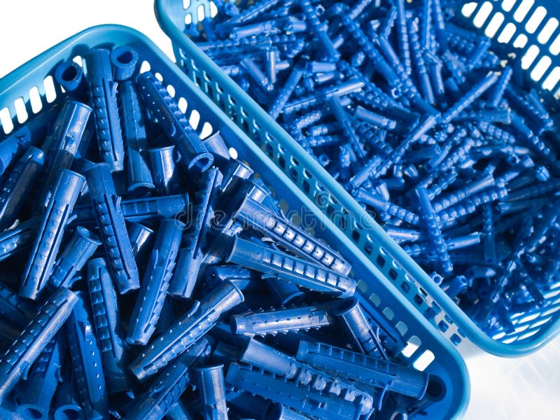 Blue plastic wall plugs stock photo. Image of parts, fixing 18528192