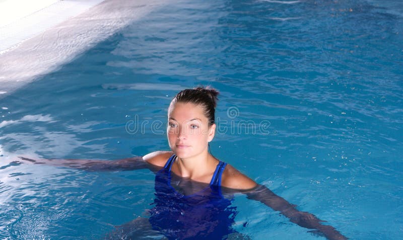 Blue pool woman beautiful swimming in water