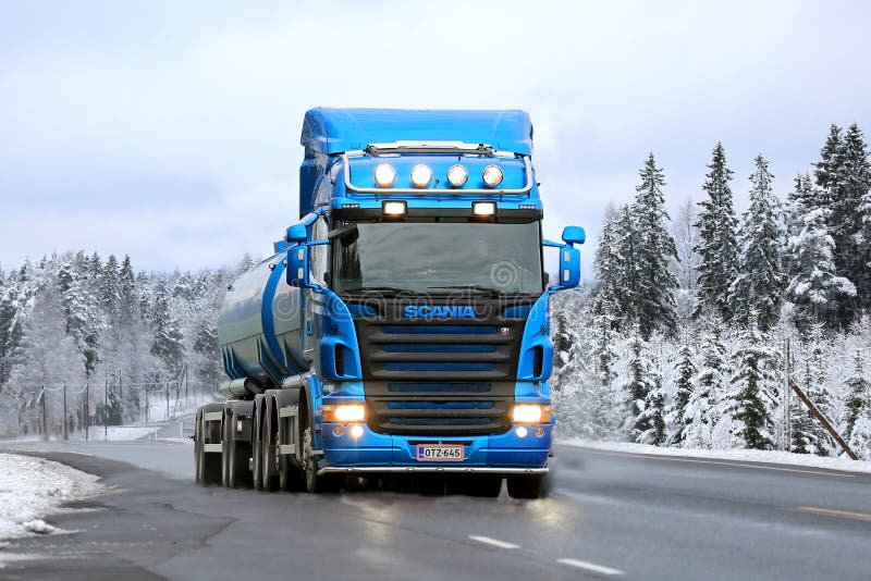 Blue Scania R500 Tank Truck on the Road in Winter