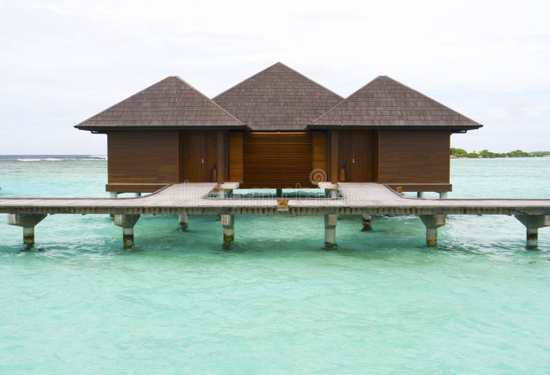 Blue sea and holiday chalets royalty free stock image