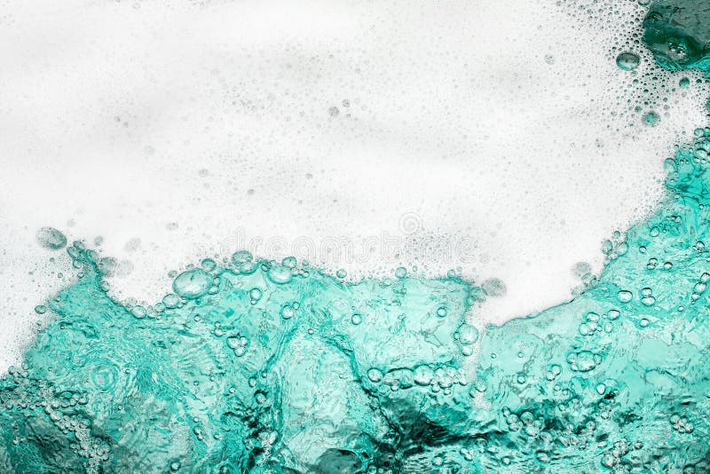 Blue sea water white foam texture background closeup, foamy ocean wave pattern, aqua bubbles surface, swimming pool backdrop