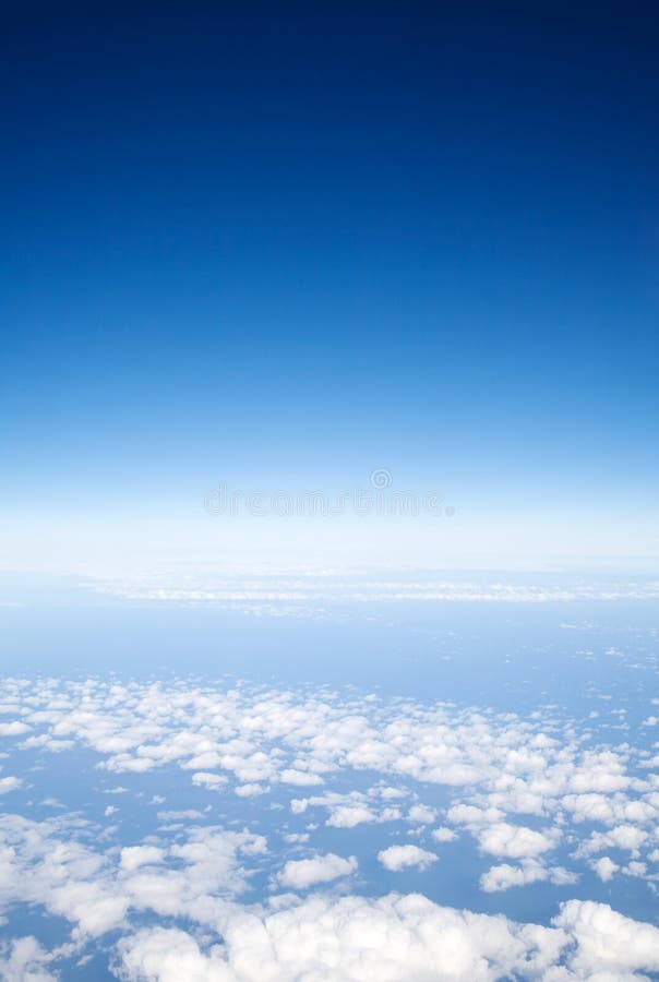 Blue sky above light clouds