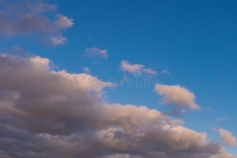 Blue sky background with dark fluffy clouds stock photography Blue sky background with dark fluffy clouds stock photography