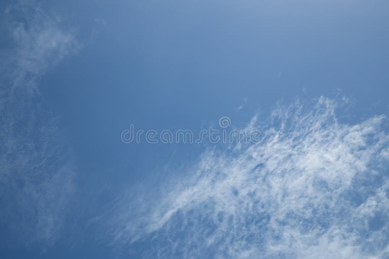 Blue sky background and white clouds passing by stock photo