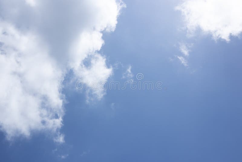 Blue sky background and white clouds passing by stock photos