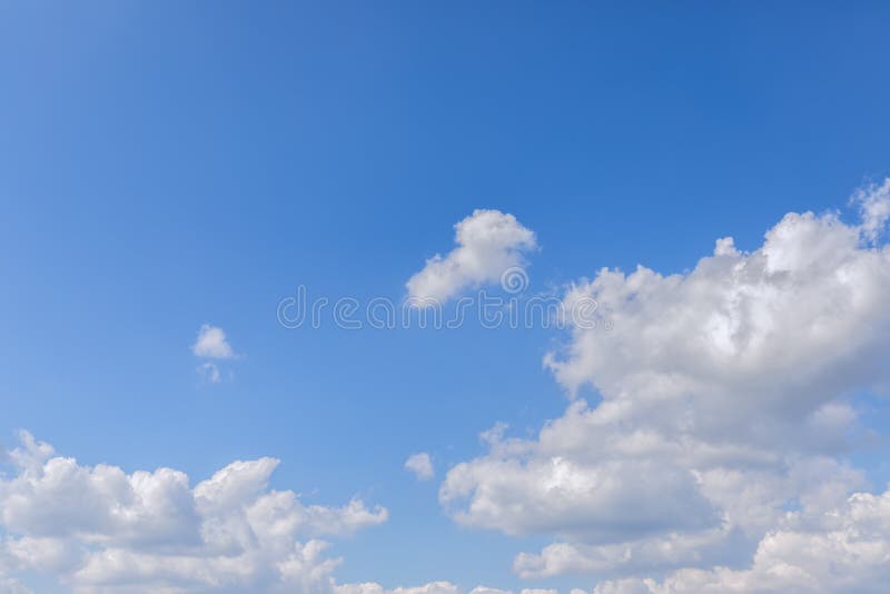 Perspective Blue Sky with Clouds and Sun on the Right Stock Photo
