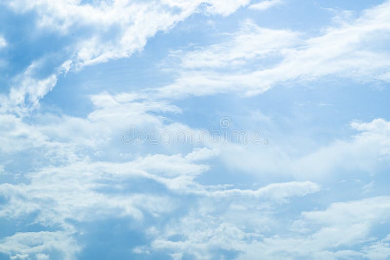 Blue Sky with Soft Fluffy Clouds on Bright Sunny Day Stock Photo ...