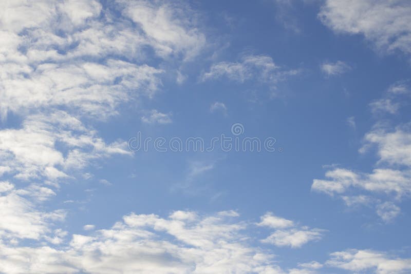 Blue sky with soft light white clouds sunny warm day