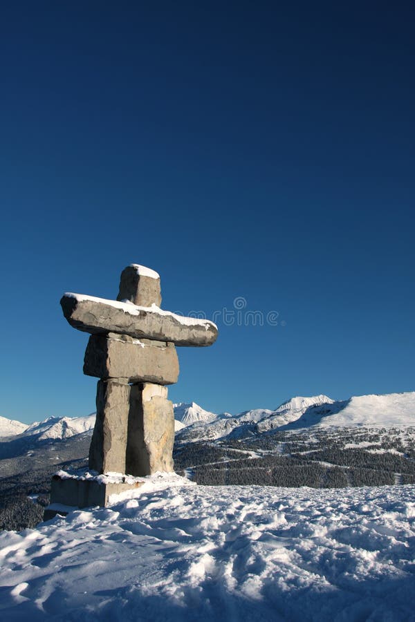 An Inukshuk (symbol of the 2010 winter olympic games and a traditional native sculpture) stands on Whistler mountain overlooking Blackcomb mountain. An Inukshuk (symbol of the 2010 winter olympic games and a traditional native sculpture) stands on Whistler mountain overlooking Blackcomb mountain.