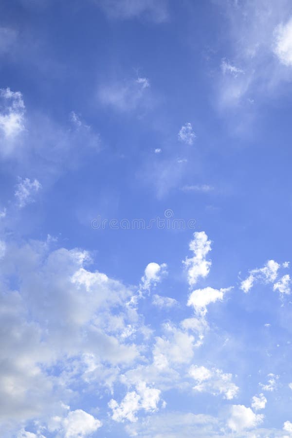 Blue sky with white clouds in vertical formation to use as wallpaper Spain. Sparse use stock images, royalty-free photos and pictures