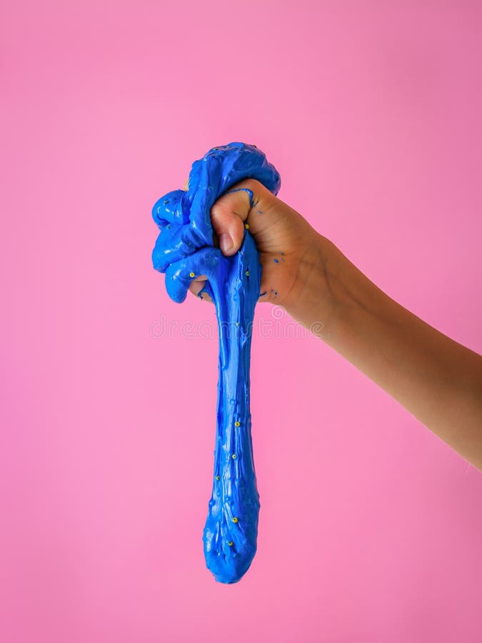 Blue Slime Falls from the Child`s Fist on a Red Background Stock Photo ...