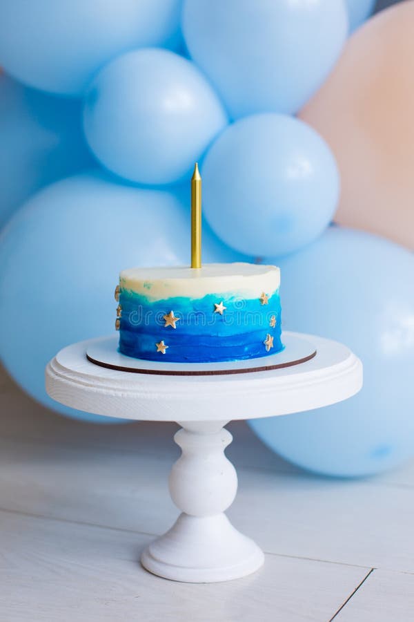 Blue smash cake for boy birthday stock image