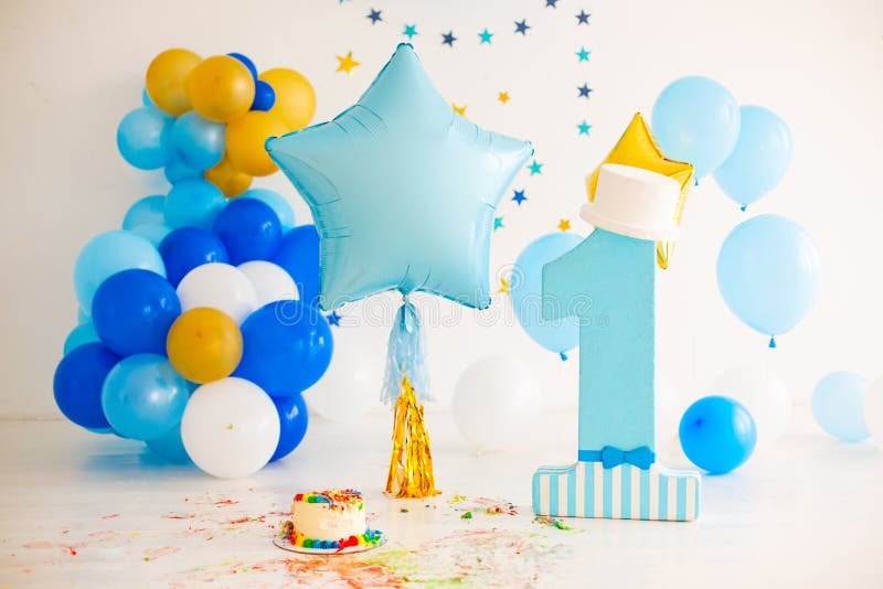 Blue smash cake for first birthday stock photo