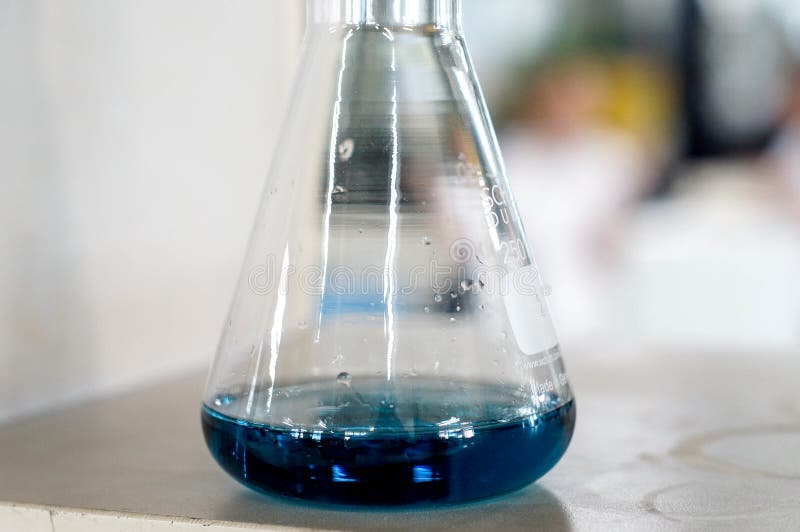 Blue solution in flask stock photo. Image of medicine 116610118