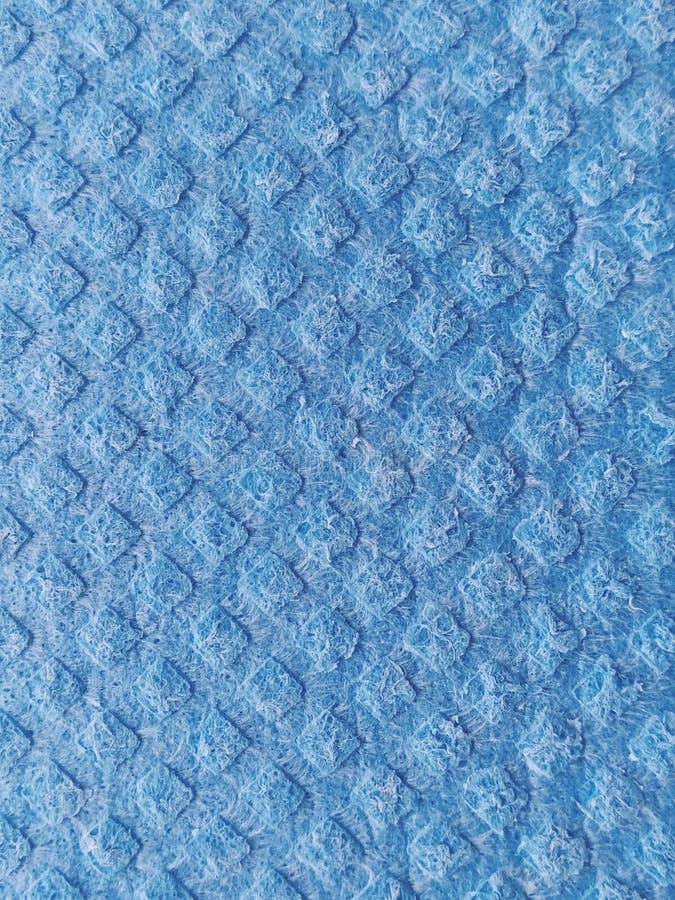 Blue Sponge for Washing Dishes, Closeup. Abstract Blue Background