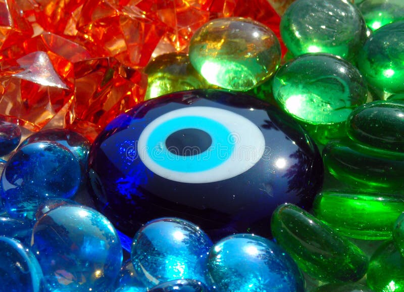 Blue Stone Eye on Coloured Glass Stones Stock Image - Image of shining