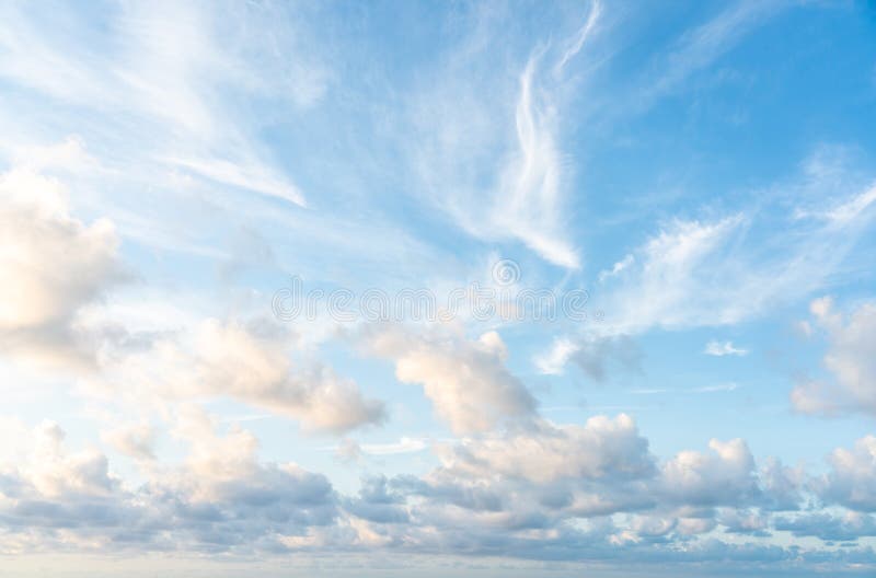 Blue sunset sky with nice white clouds