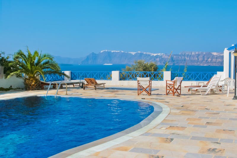 Blue swimming pool in Fira, Santorini, Greece.