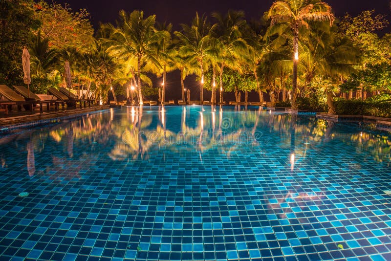 blue swimming pool with light reflections at night