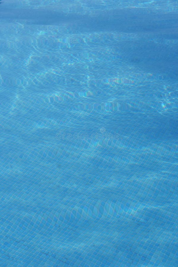 Blue swimming pool water stock images
