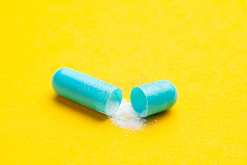 Blue Tablets in Capsules. One Capsule is Open Stock Photo Image of