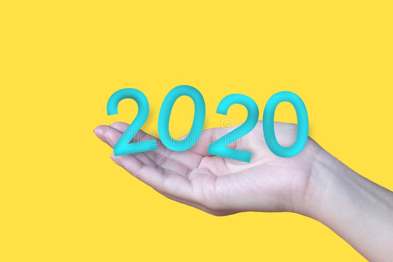 2020 Blue Text in the Hand on Yellow Background Stock Image Image of