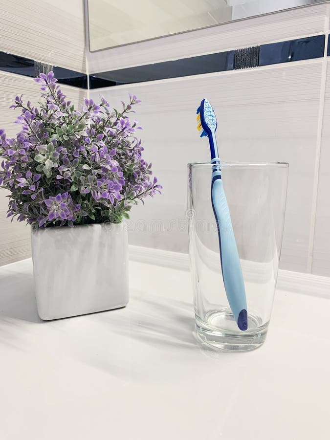 Blue Toothbrush in Glass for Brushing the Teeth. Stock Photo Image of