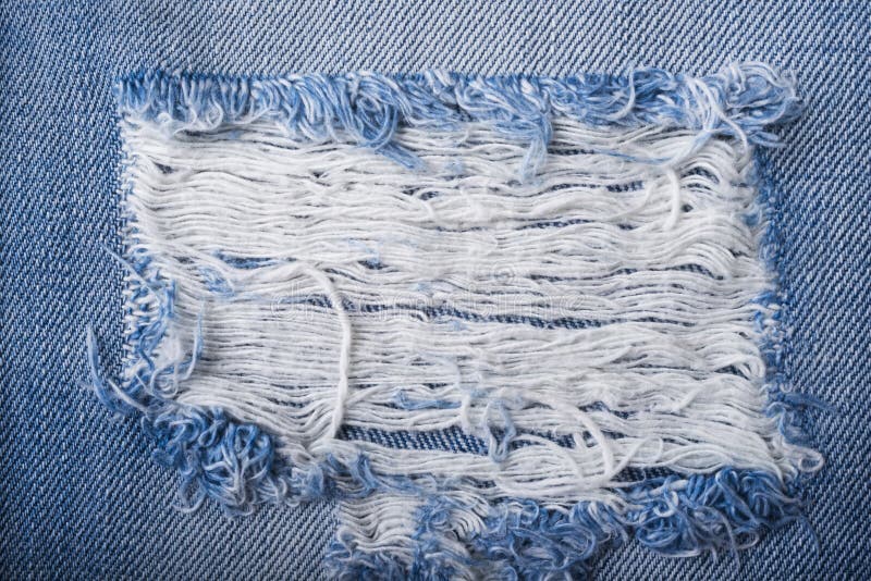 Blue torn denim jeans texture royalty free stock photography