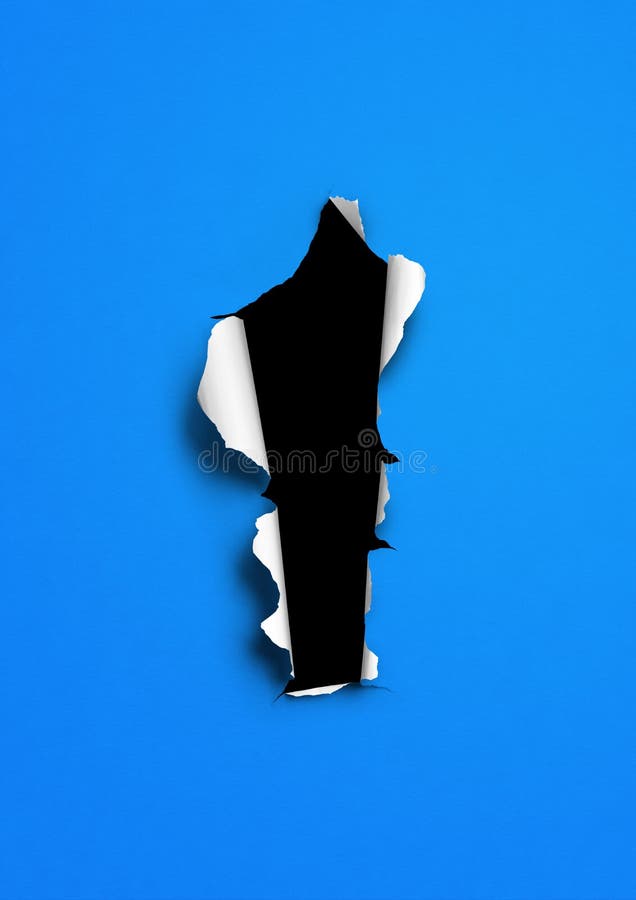 Blue torn paper with black hole stock photography