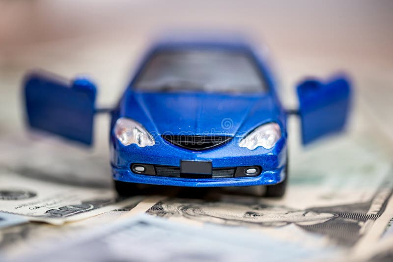 Blue toy car with dollar