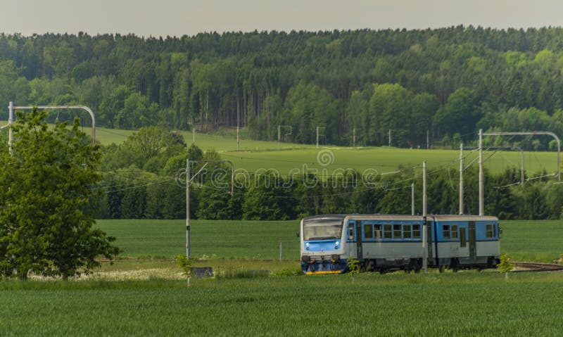 Blue train near Sudomerice u Bechyne station on old electric railway