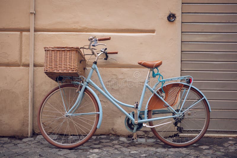 Blue vintage city bicycle with basket.