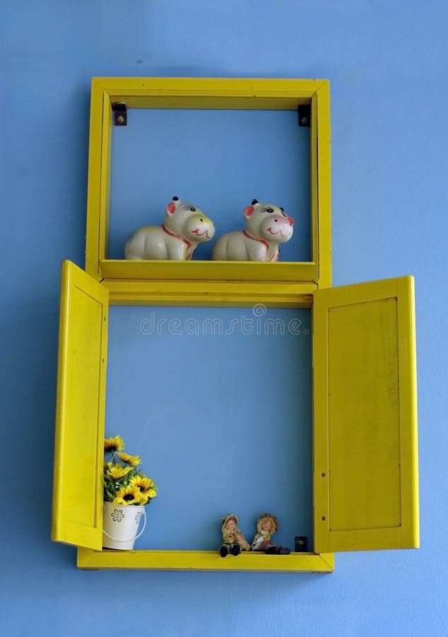 Blue wall with yellow window display stock photography Blue wall with yellow window display stock photography
