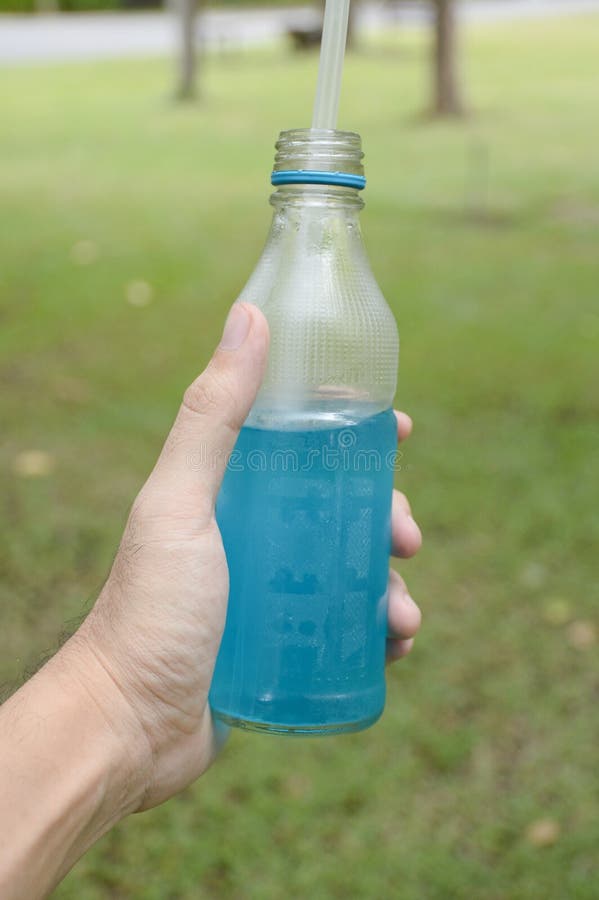Blue water drink stock photo. Image of blue, holding 80601062