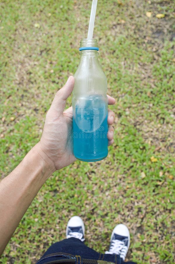 Blue water drink stock image. Image of drink, finger 84541227