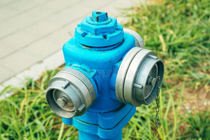 Blue water hydrant with B and C type coupling for fire hose stock photography