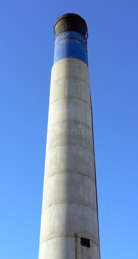 Blue, White and Black Chimney. Shot of a blue, white and black chimney, from the bottom up, against a blue sky stock photos Blue, White and Black Chimney. Shot of a blue, white and black chimney, from the bottom up, against a blue sky stock photos