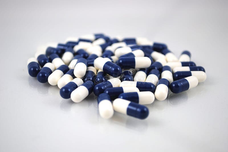 Blue and white capsules stock image. Image of backgroud 112396239
