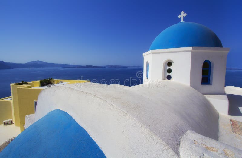 Blue and white colours of Oia City. Magnificent panorama of the island of Santorini Greece during a beautiful sunset in the Medite stock photo Blue and white colours of Oia City. Magnificent panorama of the island of Santorini Greece during a beautiful sunset in the Medite stock photo