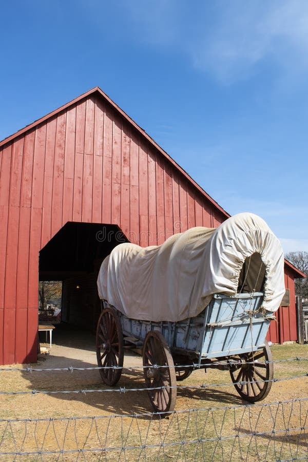 Blue and White Covered Wagon on a Farmstead in Grapevine, Texas Stock